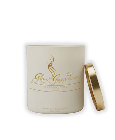 Glow Guardian candle with gold lid on a white background