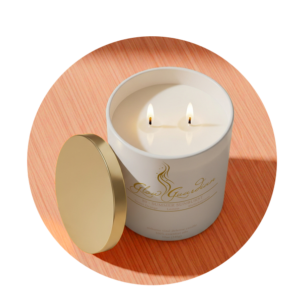 White candle in a glass container with a gold lid on a wooden surface