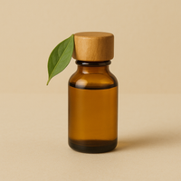 Amber glass bottle with wooden cap on a beige background